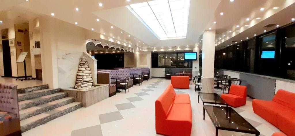 Bright hotel lounge with colourful sofas at New Tiffany's Park
